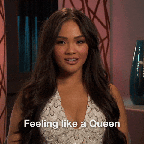 TV gif. Bachelorette Jenn Tran sits in confessional sweetly and seductively says "Feeling like a queen"