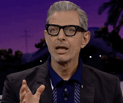 Celebrity gif. Jeff Goldblum on the Late Late Show pauses with his mouth open as his eyes dart around like he can't think of a response. Eventually, he closes his mouth.