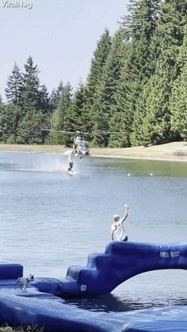 Barefoot Waterskier Hangs From Low Flying Helicopter