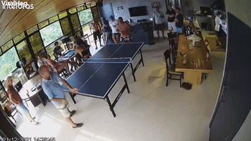 Guy Playing Ping Pong Takes a Dive on the Table