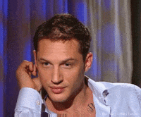 tom hardy wink GIF