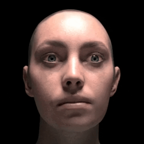 Video gif. Face deflates in slow motion. The skin sags and hangs loosely, creating an unsettling image of a collapsed, drooping face that no longer appears human.