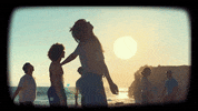 coldplay music dancing friends beach GIF
