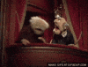 Sesame Street gif. Watching from the balcony at a theater, old men muppets Statler and Waldorf laugh wildly.