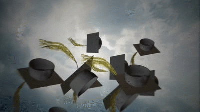 A picture of graduation caps, black with yellow tastles all being thrown in the air with clouds as a backdrop.