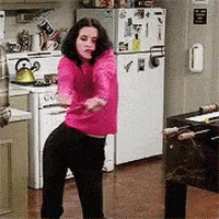 Friends gif. Courteney Cox as Monica dances awkwardly with stiff hips and arms. She has a concentrated look on her face as if she’s really focused on these bad dance moves.