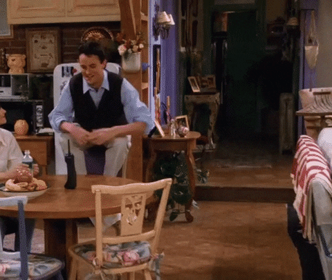 Friends gif. An agile Chandler leaps off a chair and immediately begins dancing, doing a little jig of happiness in his silly Chandler way. 