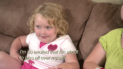 Reality TV gif. Honey Boo Boo on Here Comes Honey Boo Boo sits on a couch with a smile on her face. She shakes her head as she says, “I'm so excited that I'm about to piss all over myself.”