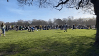 Hundreds of People Crowd Liverpool Park on St Patrick's Day