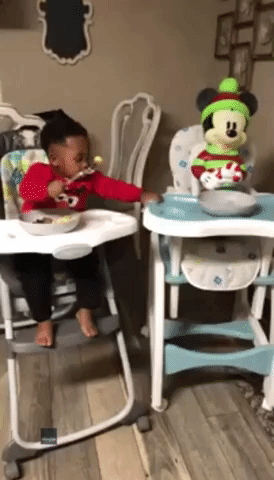 Generous Toddler Shares Meal With Mickey Mouse