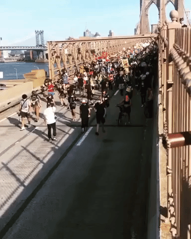 Hundreds of Anti-Racism Protesters Block Traffic on Brooklyn Bridge