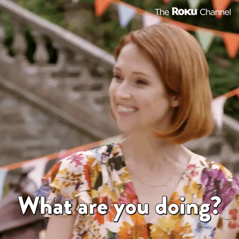 TV gif. Ellie Kemper on "The Great American Baking Show" giving an uncomfortable screwed-on smile, saying, "What are you doing?'