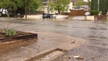 Water Flows Down Street in Southern Utah Amid Flood Watch