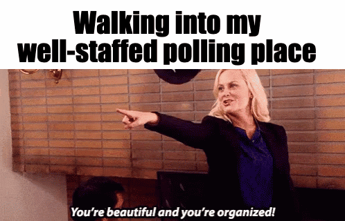 Parks and Recreation gif. Proud Amy Poehler as Leslie Knope points at someone and says, “You’re beautiful and you’re organized!” Caption, “Walking into my well-staffed polling place.”