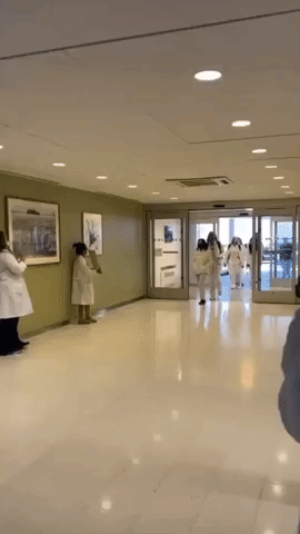 Cleveland Clinic Nurses and Doctors Cheered as They Arrive at New York Hospital