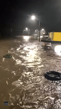 Shipping Container Floats Past Pub on NSW Highway as Flash Flooding Leaves Thousands Stranded