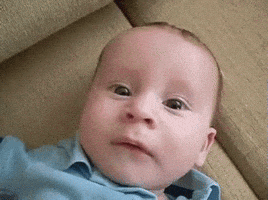 Video gif. Baby's face gets dramatically suddenly sad, frowning and then sobbing.