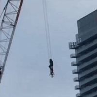 Firefighter Rescues Woman From Crane in Toronto