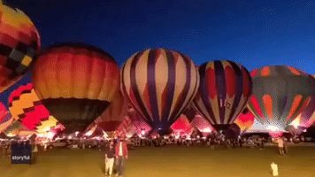 Hot-Air Balloons Flash Flames in Nighttime Display at Albuquerque Festival