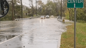 Cars Drive Through Flooded Roadway in Piscataway, New Jersey