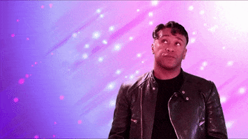 Celebrity gif. Robert E Blackmon looks slick in a leather jacket with coiffed hair as he puckers his lips and swipes 2 pointing fingers below the text beside him. Text reads, "This. All of this," against a sparkling lavender background.