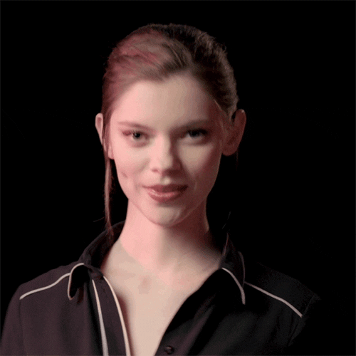 Video gif. Model wearing black pajamas smiles and nods as she gives us an “okay” sign.