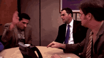 The Office gif. Steve Carell as Michael slaps the table dramatically and yells, “Thank you!”