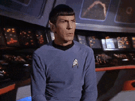 TV gif. We move into a closeup of Leonard Nimoy as Mr. Spock on Star Trek. He raises his right eyebrow in question.