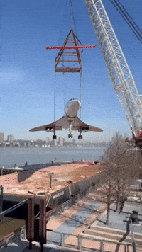 Concorde Jet Lifted by Crane Onto Museum Pier in Manhattan