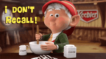 Ad gif. The Keebler elf looks at us with a suspicious smile on his face as he mixes batter in a bowl, containers for cream and cocoa on the table next to him. Text, “I don’t recall.”