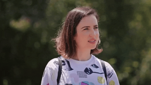 Movie gif. Zoe Lister-Jones as Liza in How It Ends cocks her head to the left, mildly perplexed.