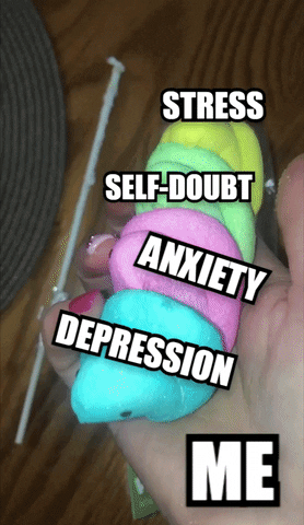 Meme gif. Person's hand holds four blue, pink, green, and yellow marshmallow Peeps, rolling them around lightly before violently squishing them into oblivion. The Peeps are each labeled "Stress," "Self-doubt," "Anxiety," and "Depression," and the hand is labeled "Me."
