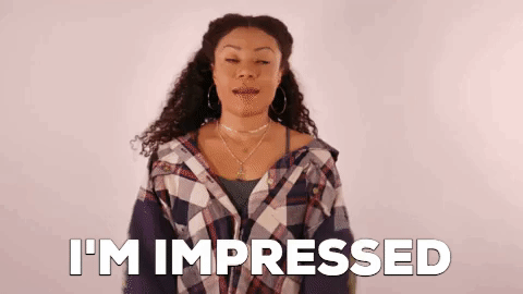 Celebrity gif. Shalita Grant looks around and crosses her arms before gesturing towards the camera and mouthing “wow.” Text, “I'm impressed.”