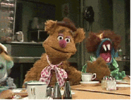 Muppets gif. Fozzie Bear drops his head into his hand, covering his eyes and looking annoyed. 