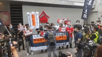 Pro-Democracy Party Members Burn Placards as Hong Kong National Security Law Introduced