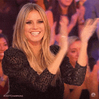 Video gif. Model Heidi Klum claps happily during her time as a judge on America's Got Talent.