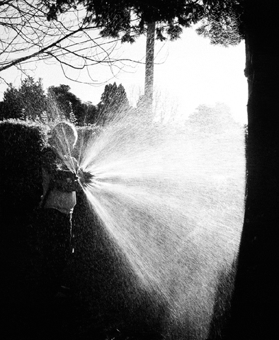 spraying black and white GIF