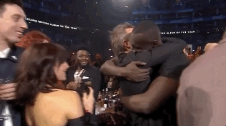 celebration hug GIF by BRIT Awards