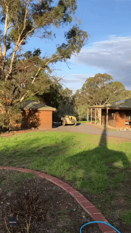 Father and Son Take Out the Rubbish Using WWII Armored Vehicle