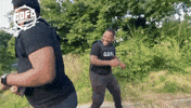 gdflbrassband laugh run punch slap GIF
