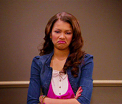 Celebrity gif. Zendaya crosses her arms and makes a pouty grossed out face as she raises an eyebrow.