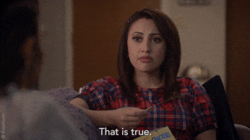 TV gif. Francia Raisa as Ana on Grown-ish sits across from Tara Shahidi as Zoey Johnson on a couch. She holds a cracker in her hand, and stares thinking for a moment with a blank expression. She then points at Zoey, tilting her head as she says, “That is true.”