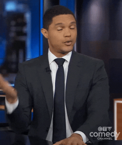 TV gif. Trevor Noah as host of The Daily Show closes his eyes and takes a deep breath as he shakes his head and fans himself with 1 hand.