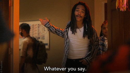 TV gif. Luka Sabbat as Luca Hall in Grown-ish holds an arm out as he exits a room backwards, looking at us and saying, “Whatever you say.”