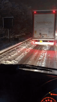 Motorists Stranded in Snow on London Motorway