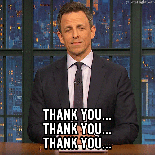 Late Night gif. Seth Meyers sits at his desk, hands folded and sincerely smiles and nods as he says, "Thank you...thank you...thank you..."