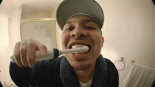 p_lo giphyupload gold grill toothbrush GIF