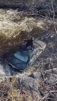 Officer and Passerby Climb Into Icy River After Elderly Man Drives Off Connecticut Road