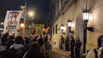 Pro-Palestine Protesters Chant in Front of Police Outside Columbia University