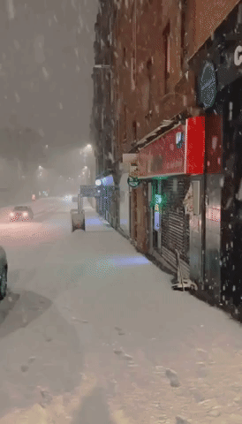 Heavy Snow Accumulates on Glasgow Street